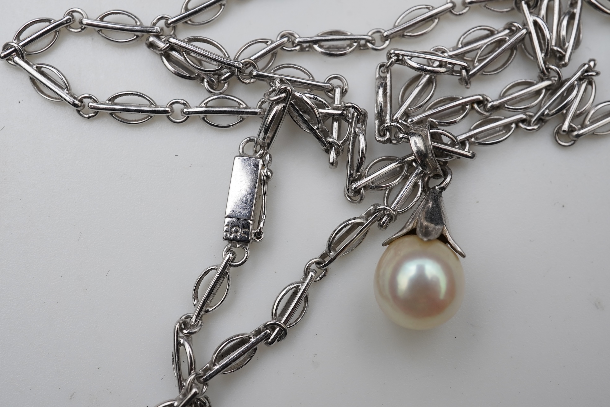 A collection of cultured pearl jewels and a cameo pendant